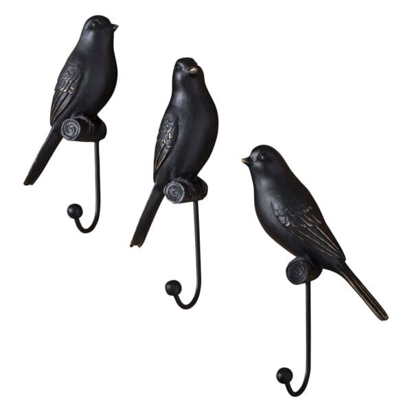Sett med 3 fugleknagger i sort og gull