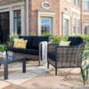 Langley utesofa i flettet raffia og aluminium