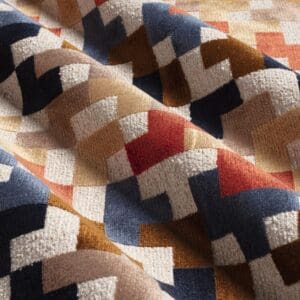Sterling, geometrisk mønstret fløyelsjacquard i rustrød/natur